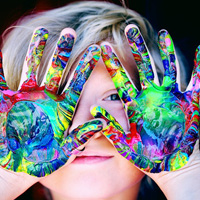 Child showing painting hands