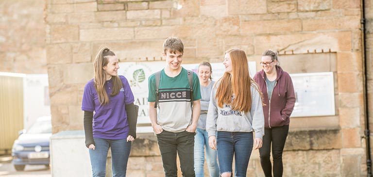 Group of students walking on campus