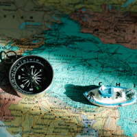 A compass, a toy boat and a map