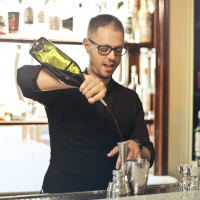 A man making a cocktail