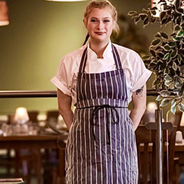 A smiling female chef A smiling female chef