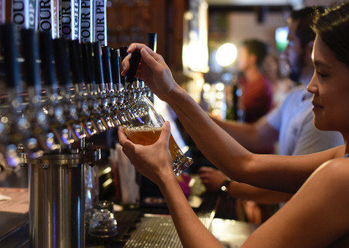 woman pulling pint