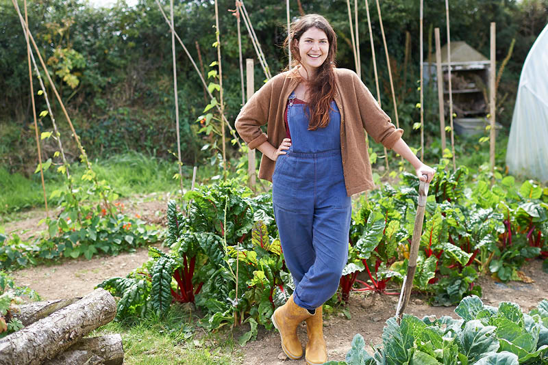 Gardener standing in a garden