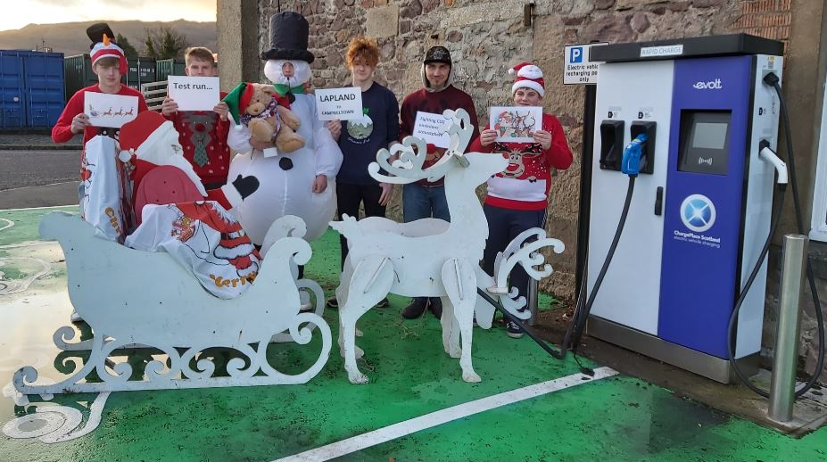 santa and helpers recharges the new eco sleigh