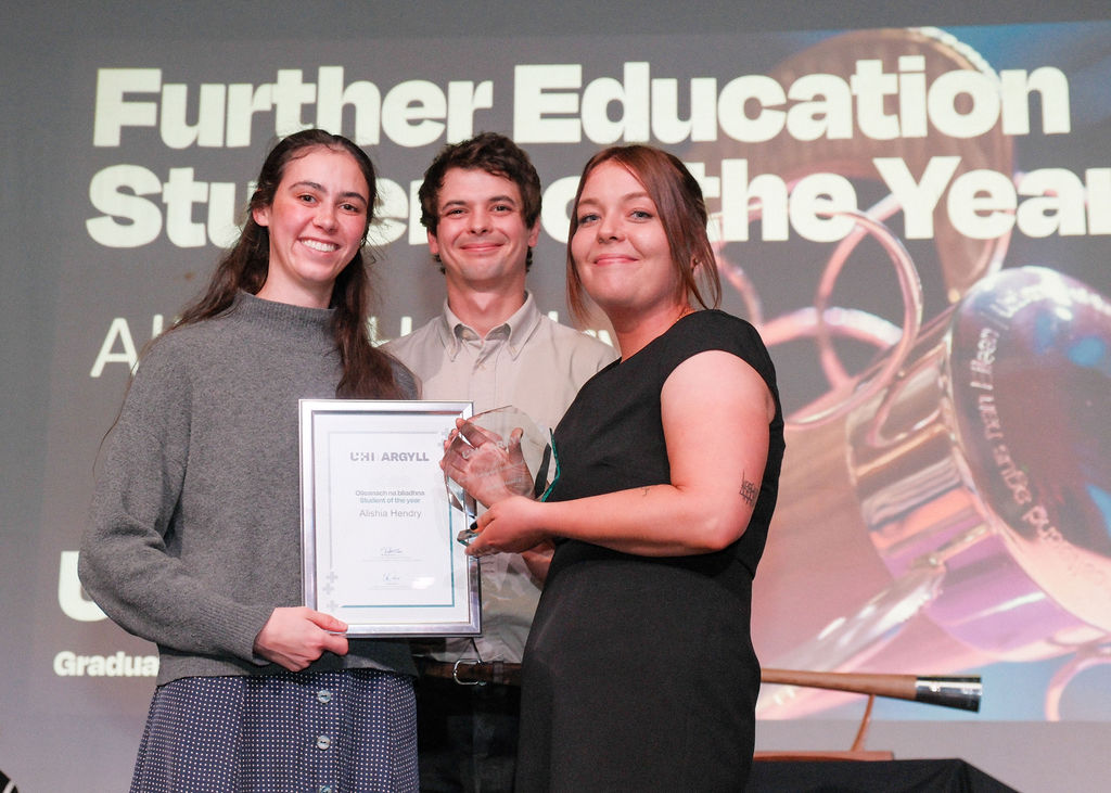 Cal and Claire presenting Alishia Hendry with her award