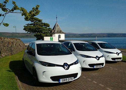 3 white electric cars