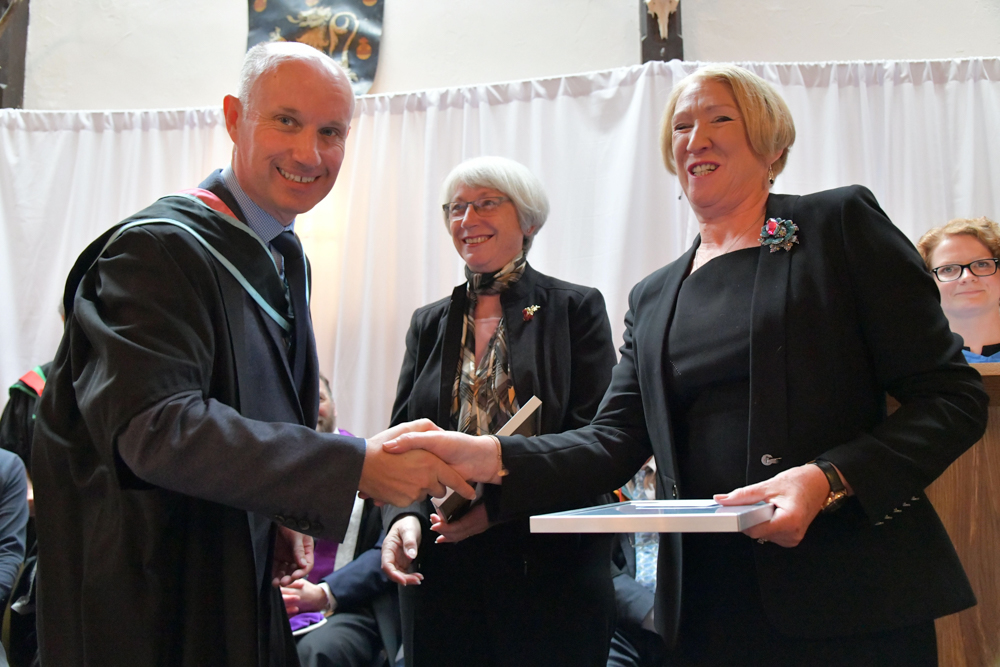 Helen How and Janet Bray receiving the SQA Principal’s Award from College Principal Martin Jones.