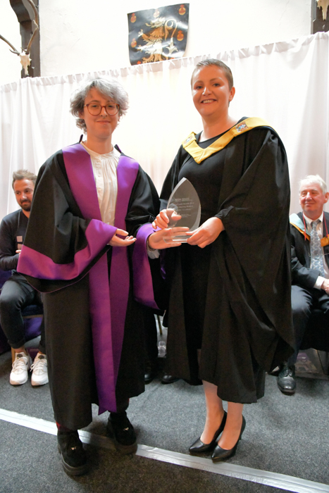 Karen Robertson receiving HISA Award for most inspiring student from HISA Vice President Natasha Morgan