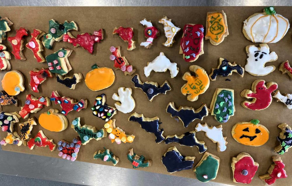 An array of empire biscuits iced with Halloween decorations