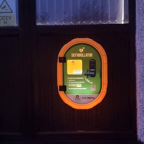 The Islay centre defibrillator lit up at night