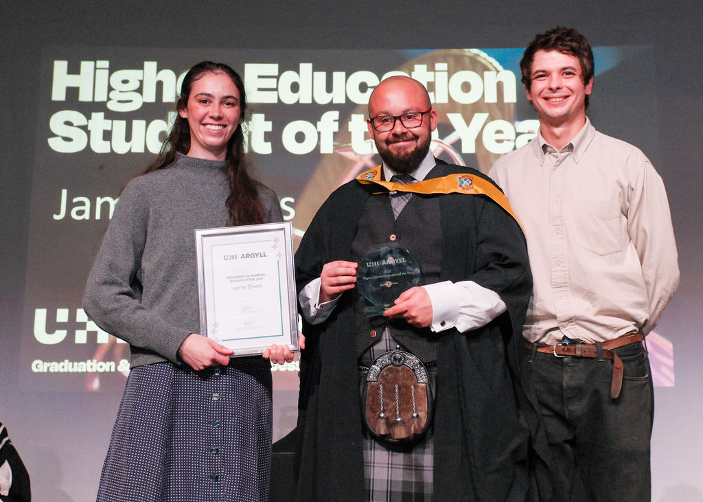 Cal and Claire presenting Jamie Divers with his award