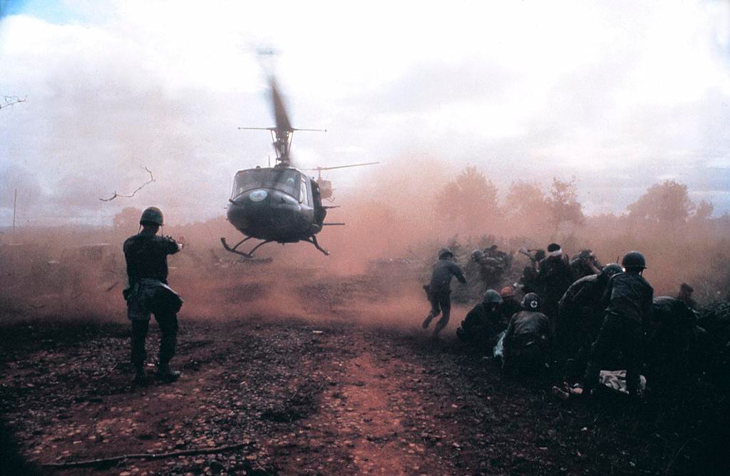 Huey helicopter landing in wartime