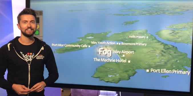 Sean Batty in front of weather map of Islay