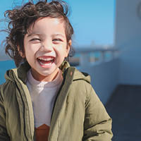 Young boy smiling at the camera