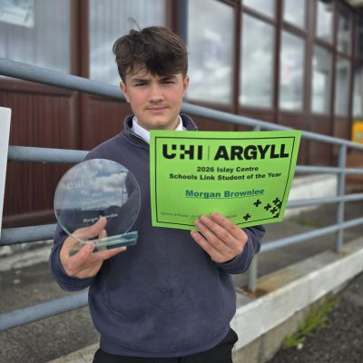 Student Morgan Brownlee with his award and certificate for being the 2026 Schools Link Student of the Year