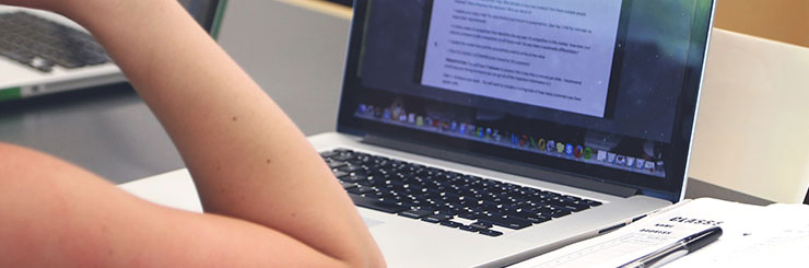 Student looking at a laptop