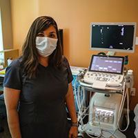 Nurse standing near hospital equipment