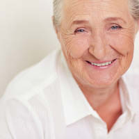 Elderly lady smiling at the camera