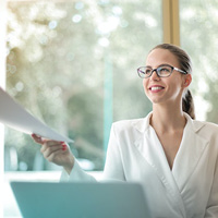 Female manager handing someone a document