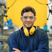 Student in goggles and ear defenders
