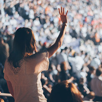 Woman raising hand to sky