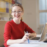 Happy woman at her desk