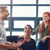 Group of staff chatting in the office