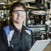 Smiling engineering student wearing PPE