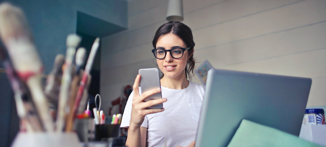 Female business student looking at phone