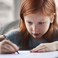 Young girl writing