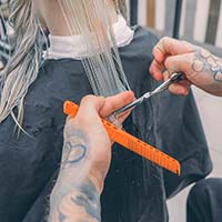 Hairdresser cutting a client's hair
